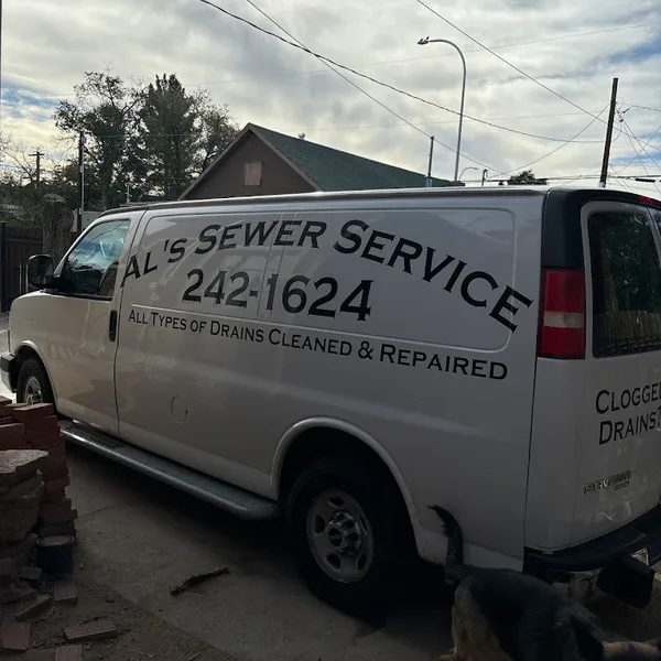 Company Van Al's Sewer Service van parked at a job site
