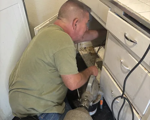 Technician responding to an emergency drain call