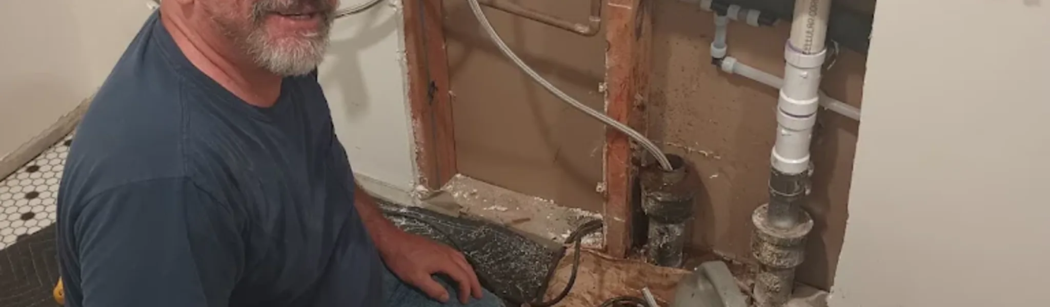 Technician performing sewer line cleaning service